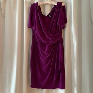 A beautiful knee length purple faux wrap dress.